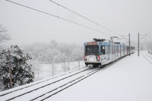 Metro Transit MetroLink train operating in snowy weather.