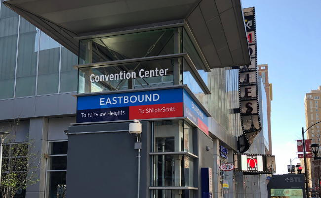 Elevator tower at street level with Convention Center signage