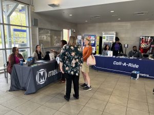 Photo of Metro Transit staff meeting with open house visitors at the North County Transit Center