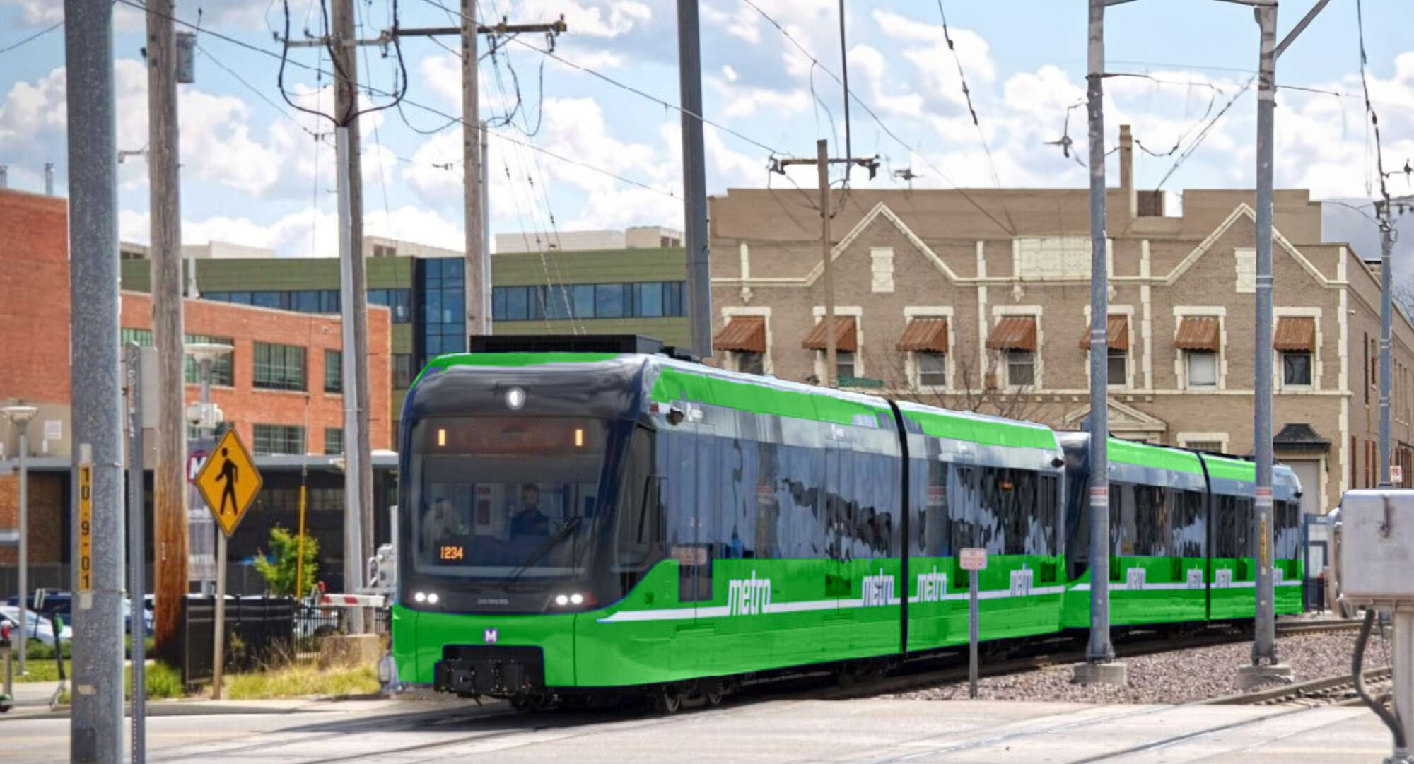 3D rendering of a ground-level, green MetroLink train traveling on the existing MetroLink track with buildings in the background.