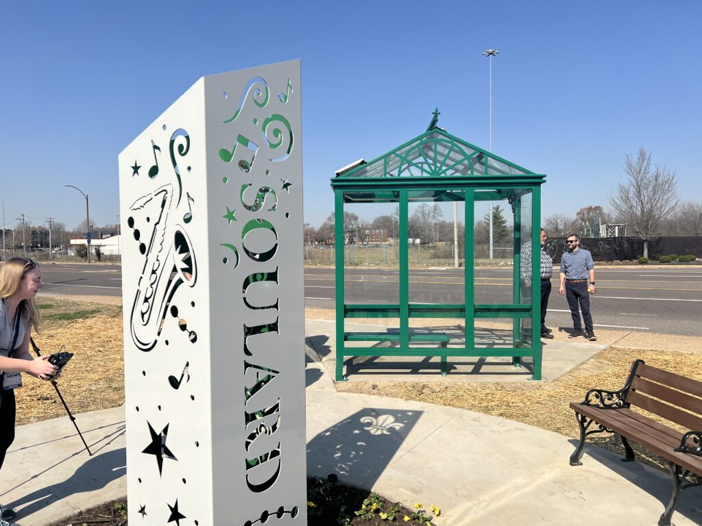 Photo of new shelter and 'Soulard' artwork at updated bus stop at 13th and Gravois